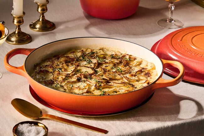 Gratin potatoes baked until crispy in a Le Creuset Flamme Doree braiser.
